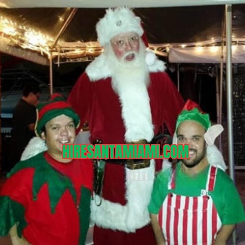 Santa with two elves at an outdoor holiday party for mrs claus for hire bookings