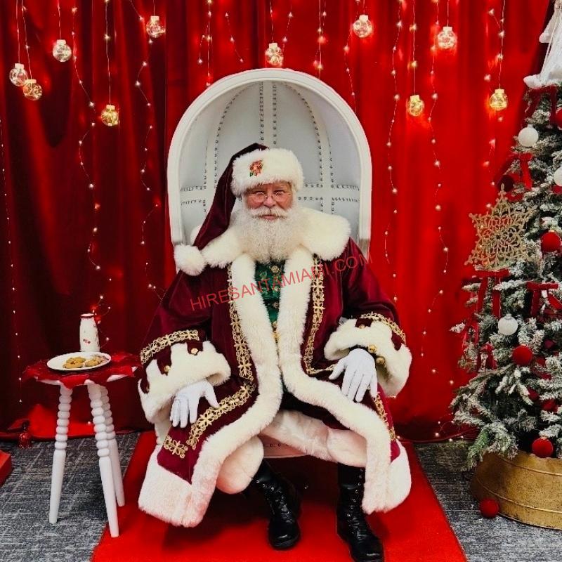 Close-up of a real-bearded Santa Claus in a red suit